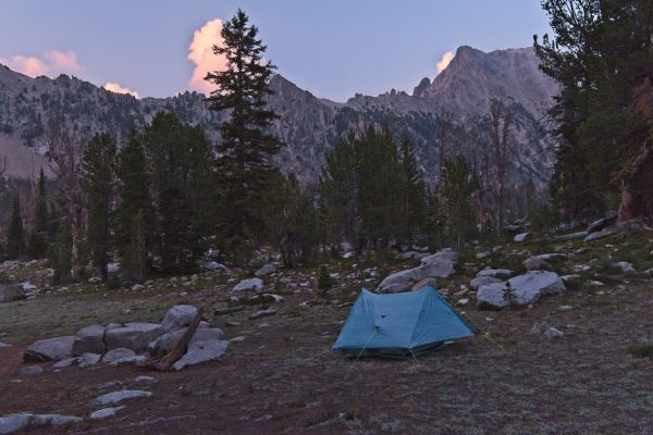 Once again, I have the “primo” camp at the southeast end of Hummock Lake (and the entire lake) to myself.  By 8:00 pm, the tent is up, food hang set, water pumped, and I am ready to make dinner.  The weather threat has diminished.  Despite being tempted by some large fish rings on the glassy surface of the lake,  I decide to fish early in the morning.  Wilderness police have been destroying the established fire rings, making it an effort to cook any fish I might catch over the coals.  Firewood is provided!
