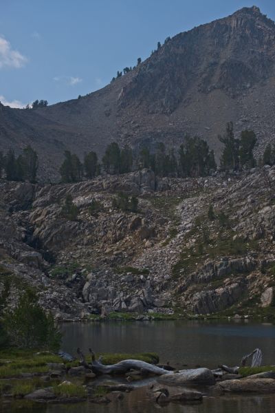 I walk completely around the Hummock Lake, catching only smaller rainbow trout that are all released.  A bit disappointing, but I have never had much success fishing this lake twice before.  The trail climbs above the steep inlet at the south end of the lake, to Windy Devil, beyond the trees in the low point in the saddle left (east) of the peak.  I break camp, and head up to Scoop Lake, fly rod in hand.
