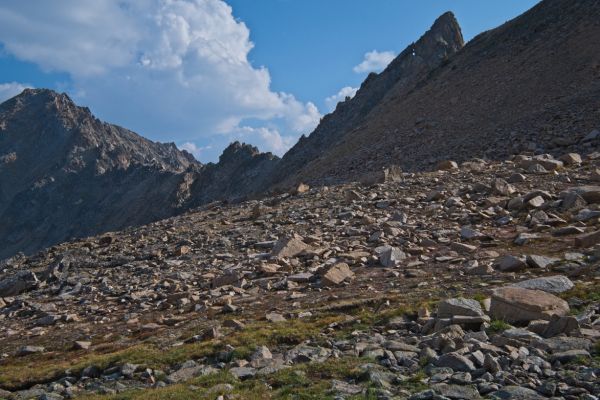 The “keyhole” revealed.  This marks the entrance to the Devil’s Staircase, the steep descent to Born Lakes on the west side.  This turned out to be considerably further than I remember from my first trip into the Boulder Chain Lakes basin five years ago.  I am very good at remembering the positive, and underestimating difficulty.  Nonetheless, the climbing went fast utilizing an excellent trail that avoided the scree.
