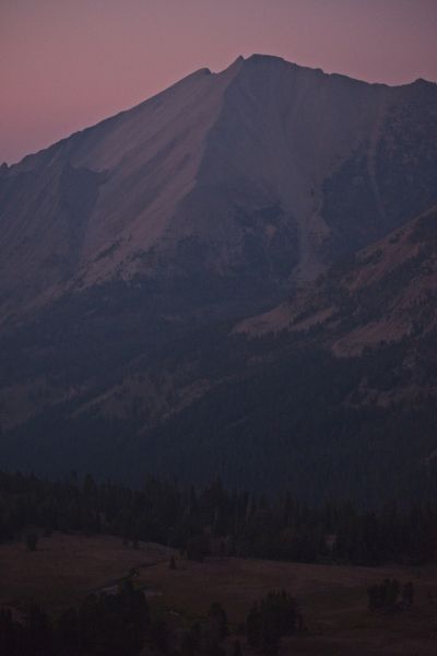 At 8:30 pm I reach the ridge top, but there is still a bit more uphill.  I photograph D. O. Lee Peak in the hazy, fading light, have a snack, and continue.  I see headlamps ascending the trail.  I finally take out my headlamp.  At 9:20 pm, I meet a woman headed for Born lakes, and advise her where to find the Z-packs tent city.  Twenty minutes later, there is a group of five headed for Washington Lake, intending to take Splatski"s Cutoff the next morning and climb Castle Peak.  I reach the car at 10:23 pm.
