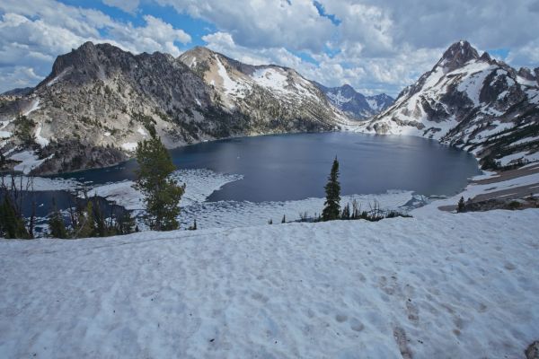 The trail heads S along the E side of the lake, and drops through the low saddle, S of Sawtooth Lake to descend the North Fork Barron Creek.  Last year on 6/27, the lake was completely free of ice.
