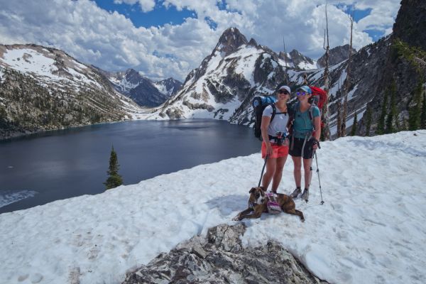 As I am taking photos, Amanda (red pack), and her Norwegian companion (and well-behaved dog) arrive at the saddle for the first time, overwhelmed by the amazing and well-earned view.  I offer to capture the moment for them.  We met before reaching McGown Lakes.  They are taking 3 days to do the same loop I am doing as a dayhike.  Their plan is to camp at off-trail Lake 8771, which I visited in August 2019.  We play leapfrog to the south end of Sawtooth Lake, where I stop to get water.
