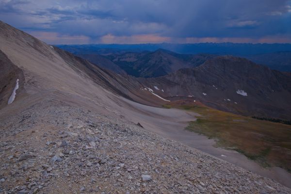 From the D. O. Lee/WCP-9 saddle, the view west-southwest beyond Ants Basin, across the Sawtooth Valley to the Sawtooth Range.  There are numerous storm cells in the distance.

