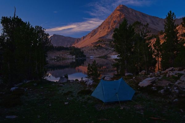 The spot I had planned to set up camp was occupied.  I’ve never seen anybody camped there.  This turned out to be a better camp, and far enough from the lake to avoid any hassle from wilderness police.  I got to bed at a reasonable hour.  This was the first night I set up the tent, due to threatening weather, and mosquitos.  I got up early, after a good night’s sleep, to catch some alpenglow on the peaks above Cove Lake.
