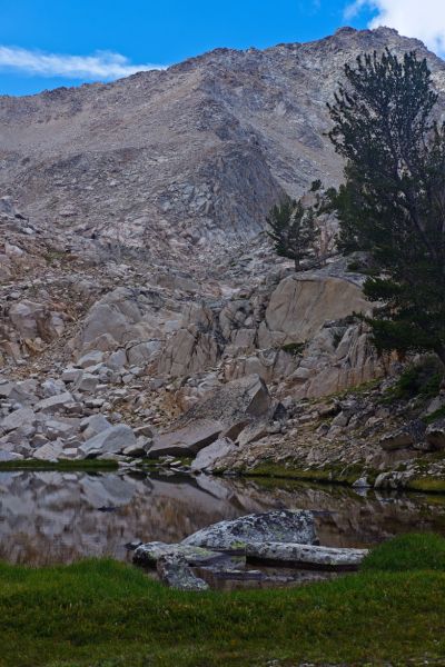 This tarn is the last convenient water before Hummock Lake.  I gained the ridge in the right foreground.  The route crosses the ridge in the center of the photo coming down from the skyline at a point roughly one third down from the top of the frame.  That point lines up with the top of left most tree on the buttress in the foreground.  The route then ascends to the left in the less steep section well above the drainage.
