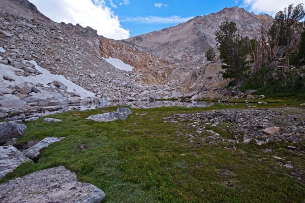 The I found it was more stable to climb to a point above and right of the saddle, reaching a point on the skyline almost to where the white cumulus cloud intersects the blue sky.  The route unfolds nicely as one climbs.
