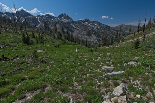 The Monte Verita ridge extends northwest towards Grandjean and includes Tohobit and Grandjean Peaks.  Hidden from view, to the southeast (left) on this same ridge is Warbonnet Peak.  The ridge culminates at Monte Verita, a complex group of granite spires at over 10,000 feet, southwest of Baron Lake.
