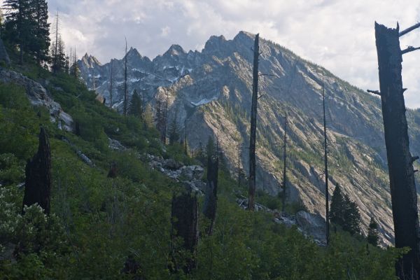 Grandjean Peak on the northwest end of Monte Verita ridge consists of five summits.  According to Tom Lopez (Idaho, a Climbing Guide), the "summits form a ragged, sawtooth line that is seldom approached by climbers.  Crossing Baron Creek in the spring can pose a very serious risk."
