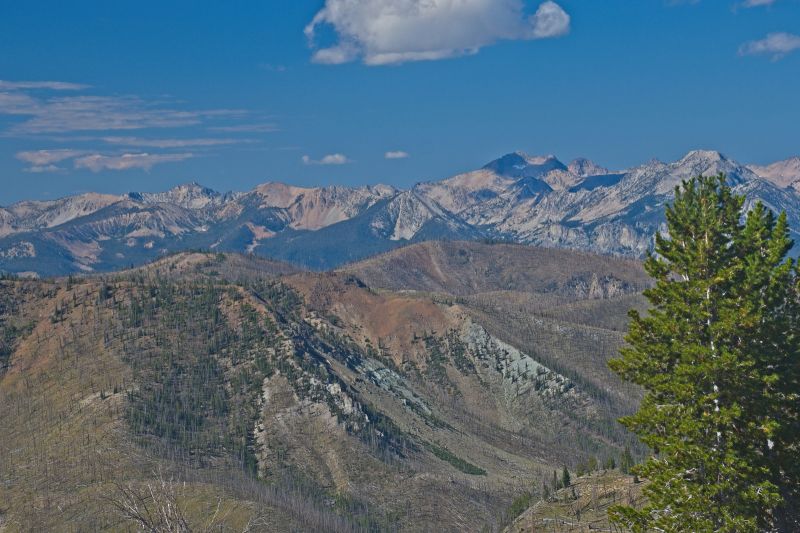 I'm thinking that peak furthest west, to the left of the peak with the shadow (below the cloud), is Mount Cramer, above Imogene Lake.  Let me know if I'm wrong!
