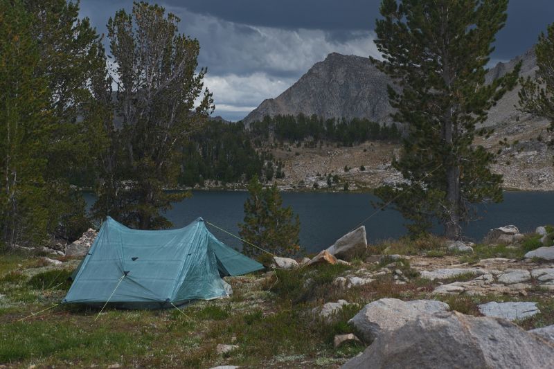 I was fishing off those rocks at the intake of Cirque Lake.  I had been looking down, untangling a rat's nest if leader for 15 minutes or so.  I finally succeeded and looked up to see a thunderstorm barreling down on me from the east.  I scurried back to camp in intermittent rain.  A short time later heavy rain started, turning to wind-driven hail.
