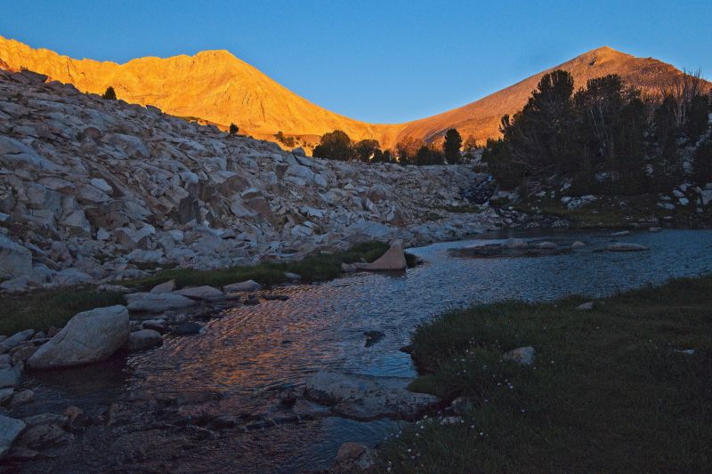 WCP-9 / D. O. Lee Peak saddle; alpenglow at dawn from inlet at Cove Lake, Big Boulder Lakes Basin.  As predicted, this morning is unseasonably cool at 34F.  The monsoonal moisture has departed, leaving it clear and cold.  The sky is cloudless; no threat of thundershowers, but photographically less interesting.
