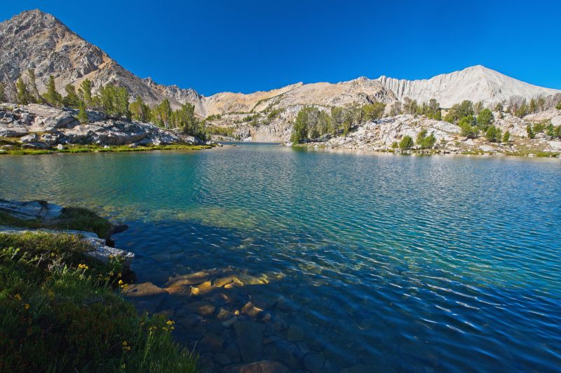 It is already 11 am as I reach the northeast side of Cove Lake; not an early start.  The dry air made it much easier to pack up the tent and sleeping bag.  I could have gotten and earlier start.  I figure I will take my time since there is no thundershower threat, and it is much cooler.  D. O. Lee Peak on frame right.
