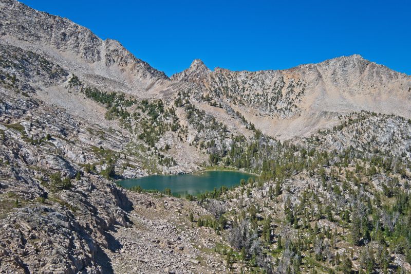 I hiked up to Headwall Lake, and fished the deep water below the steep rocks half way around the far side of the lake.  No luck.  The top of the "Cheese Grater" is on the skyline about one third the distance from the pinnacle (directly above Headwall Lake) to the peak on the right of frame.  This shot gives you an idea of how steep that route is.
