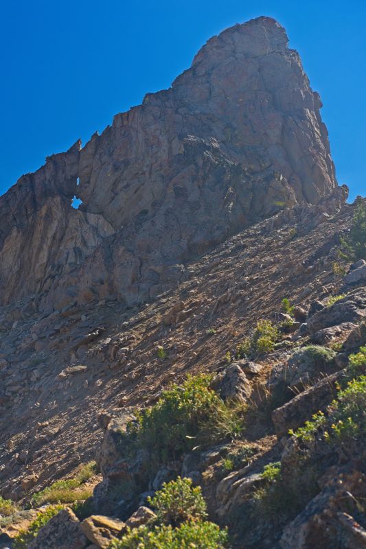 Four switchbacks lead to the top.  The vegetation keeps the trail from being eroded away.  One can see in earlier shots that water from recent thunderstorms cut a path straight down the face.
