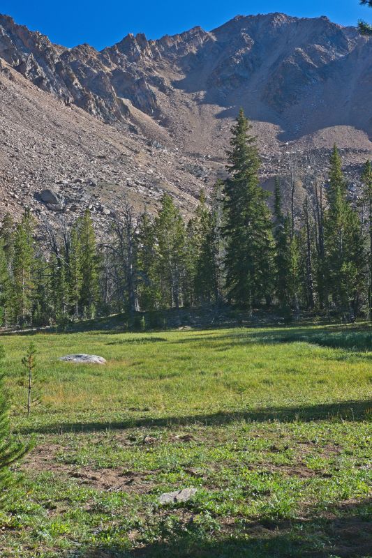 A grassy meadow between the lakes.  Since I'm carrying the camera on the shoulder strap, I don't hesitate to take the photo.  If I had to take the pack off to get the camera out, I probably would have kept right on g is on the right (east).
