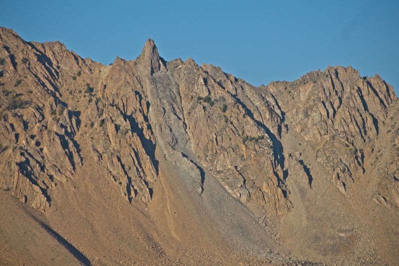 One can see the two chutes of the “Devils Staircase” shot from the ridge above and west of Ants Basin.  The north chute I descended is entered at the tree on the skyline, just left of the smaller pinnacle left of the highest pinnacle.  The chute is wide, and many paths crisscrossing back and forth.  I have not explored the south chute.  Much of it is shadowed by a subsidiary ridge, hidden from view.
