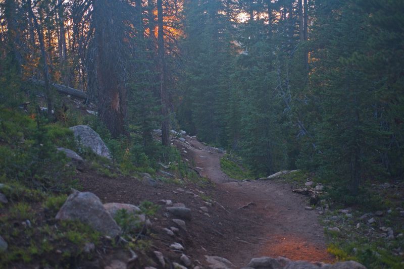 It's warmer at this lower elevation.  The sun has set into the clouds rolling in from the west; monsoonal moisture is returning.  The trail usually seems to go forever in this last stretch, but less so this trip.  I'm making good time.  I recognize the terrain to the north when I am near the trailhead, as that is where I started my "epic loop".
