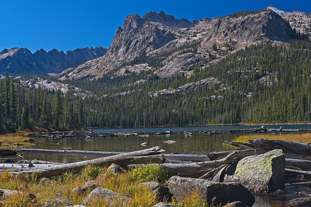 The outlet to Hell Roaring Lake is reached in roughly five miles from the lower trail head.  A log bridge makes crossing the outlet to the south shore of the lake trivial.
