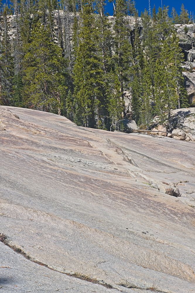 Ascending granite slabs above the waterfall cascading from Lake 8556'.  These highways simplify alpine travel.  I make use of them whenever I can; no stepping over downed trees!
