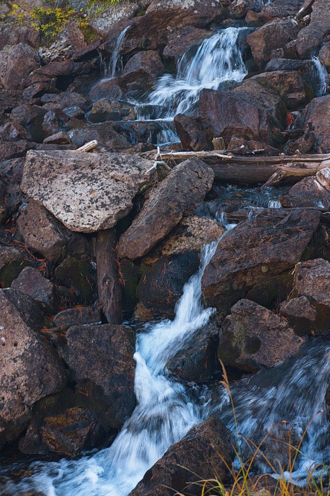 The outlet below Imogene Lake crosses the trail coming from the west.
