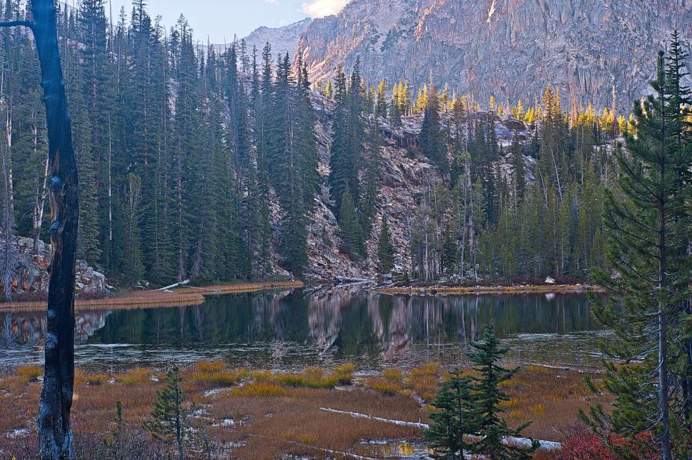 Twenty minutes below the outlet of Imogene Lake, I arrive at the unnamed lake at 8260'.  This is the same lake I arrived at in the dark last night about midnight on my way back to camp after climbing Cramer.  It looks better in the daylight!  Those who climb Cramer from the trailhead usually begin the cross country trek west toward the summit in the vicinity of this lake.  I need to pick up my pace, as it will be dark again in less than two hours.
