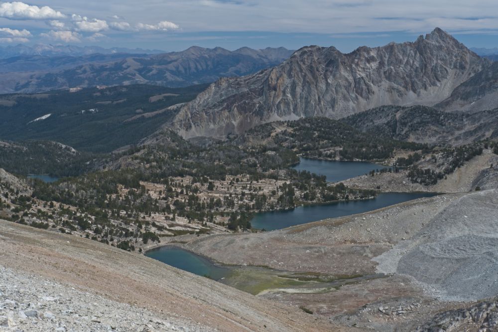 From just below the saddle, Cirque, Sapphire, and Cove Lakes of the Big Boulder Lakes Basin.  I plan to camp at the inlet to Cove Lake, the lower of the three lakes.  There is noticeably less water flowing into Cirque Lake from the S.  Green algae has been left behind by the receding water level.
