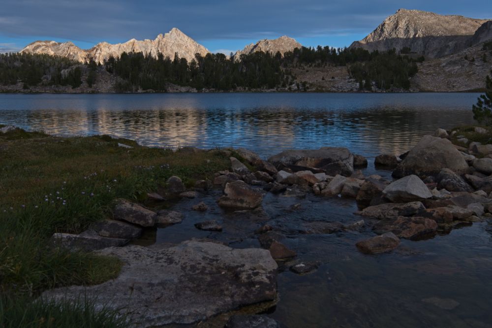 Same angle, but with a 24mm focal length.  The breeze calmed down a bit while swapping lenses; I was now able to pick up some nice reflections in the water.
