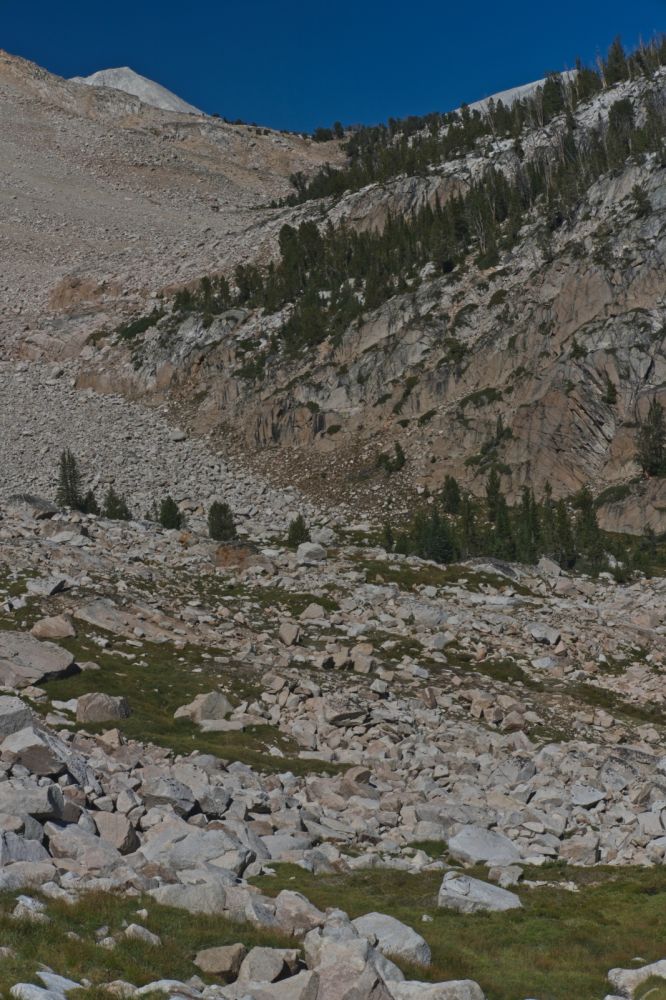 D. O. Lee Peak and WCP-9 are once again visible on the skyline to the ENE.  The descent from Cove Lake is on the north side of the drainage, tucked in close to the cliff above all those boulders.
