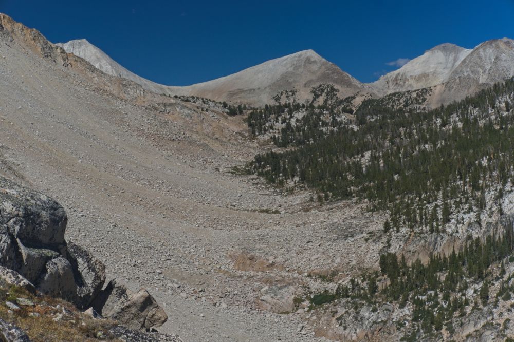 The saddle between D. O. Lee Peak and WCP-9 I crossed two days before has now come into view.  Today, Thursday, was forecast as breezy.  Thus far, what little breeze there is has been welcome; nothing like what I experienced climbing to the saddle between D. O. Lee Peak and WCP-9.
