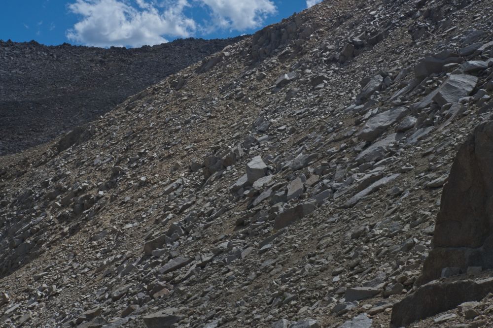 This last traverse to the lower saddle is probably the crux of the ascent because the scree is so loose!  Everything wants to slide and take me with it!
