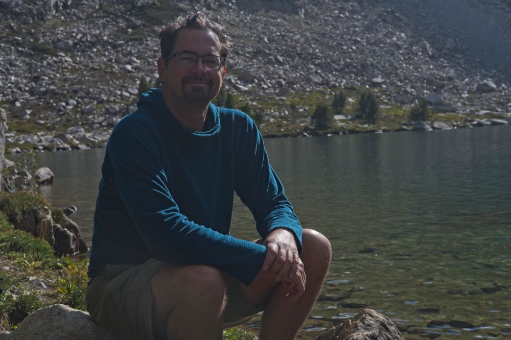 Here sits Derek, on a boulder (since he offered me his chair), posing for his portrait.  He is setting up camp in a great place I have camped before, after taking a swim.  He walked in from Fourth of July Creek trailhead, via Devil's Staircase, this morning.
