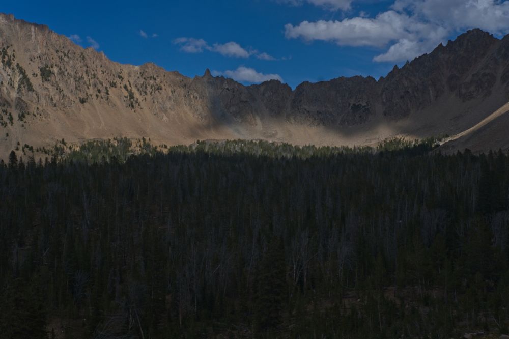 From Ants Basin, looking E above the Born Lakes (hidden in the trees) to the pinnacle immediately S of the Devil's Staricase.  Skies have cleared.
