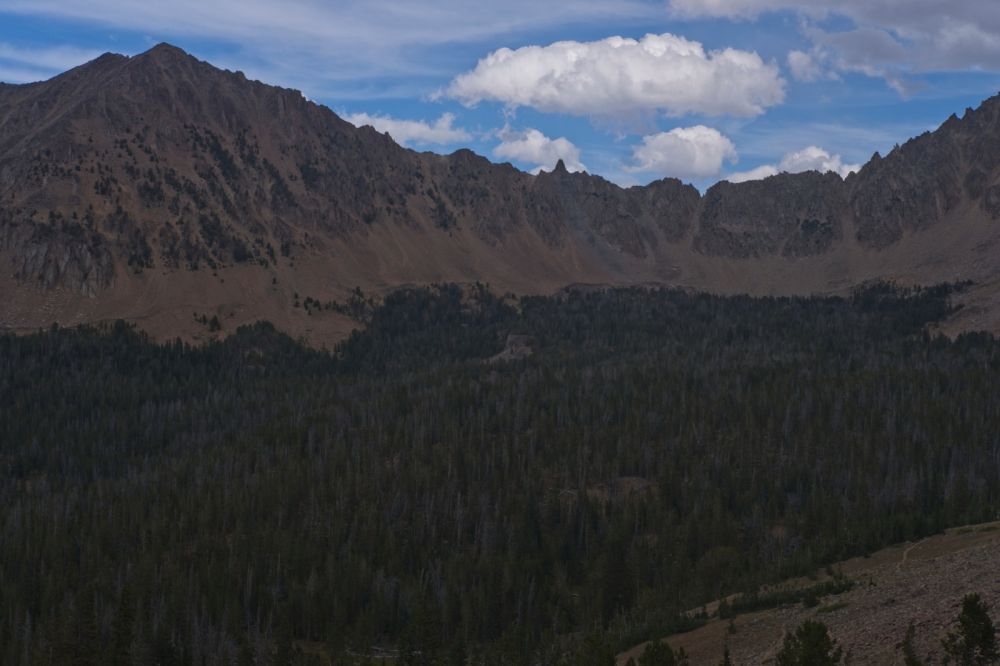 Climbing out of Ants Basin, looking ENE across the upper reaches of the Warm Springs Creek drainage below the Born Lakes.  The pinnacle marking the Devil's Staricase is prominent on the skyline.
